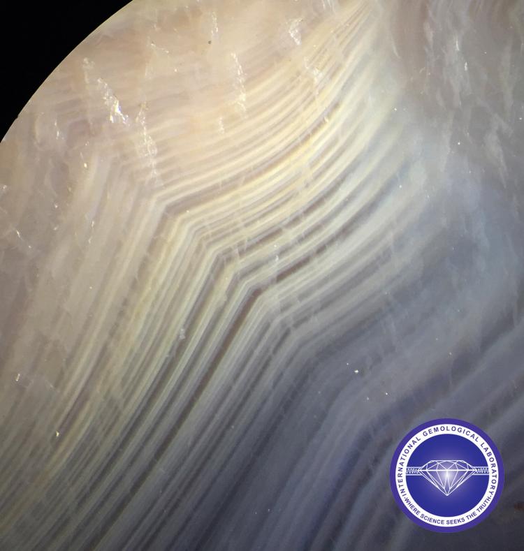 Curved or Angular banding in a Natural Agate (Chalcedony).  - Photo by: Naveed Zafar G.G., AJP (GIA).