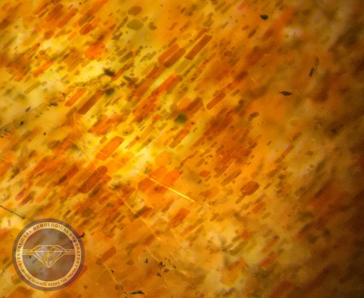 Hematite Inclusions in a Natural Sunstone Oligoclase Feldspar - Photo by: Naveed Zafar G.G., AJP (GIA).